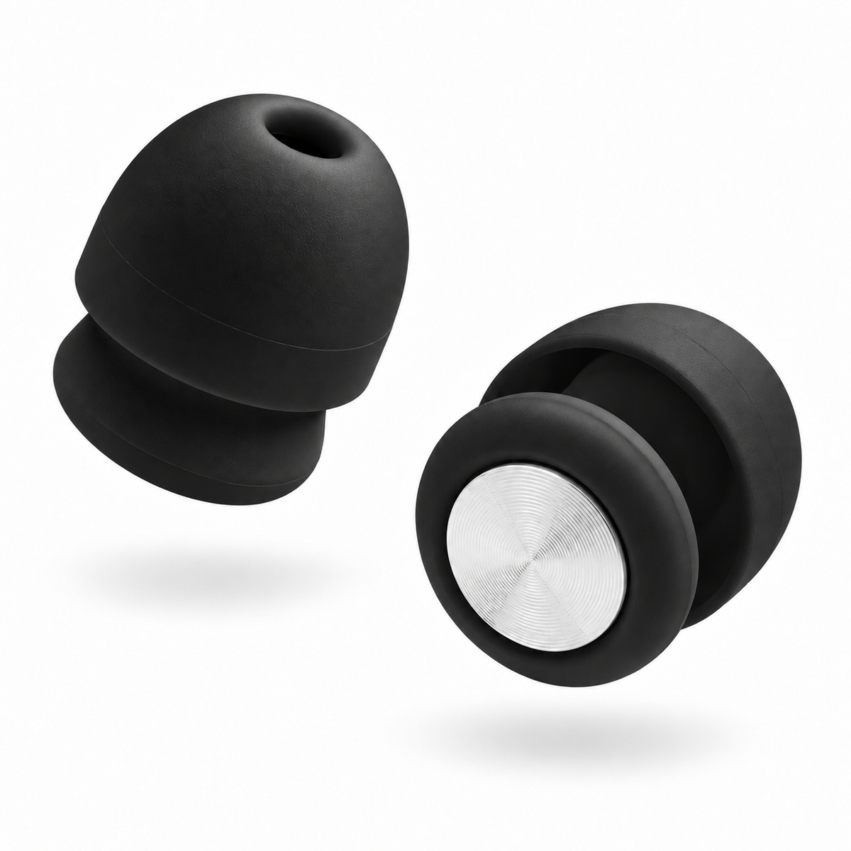 A pair of Roam Everyday Invisible Earplugs in Midnight with a silver metallic center ring, shown floating against a solid white background.