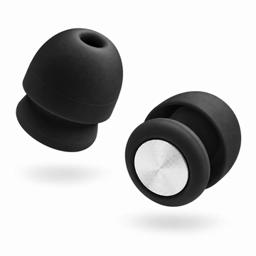 A pair of Roam Everyday Invisible Earplugs in Midnight with a silver metallic center ring, shown floating against a solid white background.